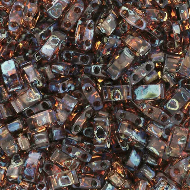 Χάντρα Miyuki Half Tila No4502 Picasso Dark Amber Transparent ~7gr